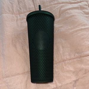 Green studded Starbucks cold cup